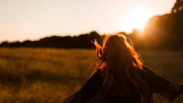 woman standing on grass field