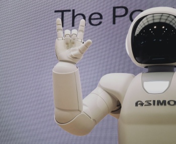 Asimo robot doing handsign
