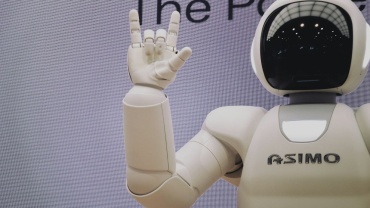 Asimo robot doing handsign