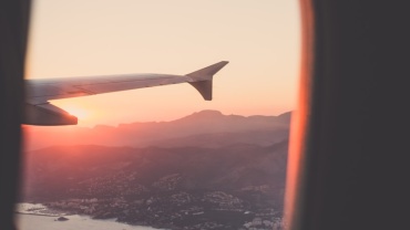person riding airplane photography