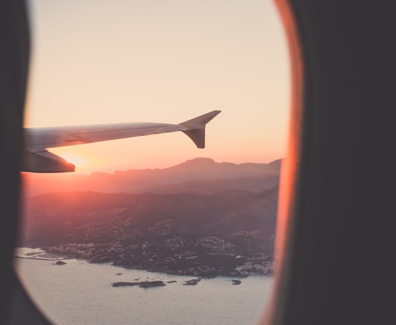 person riding airplane photography