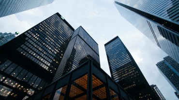 low angle photo of city high rise buildings during daytime