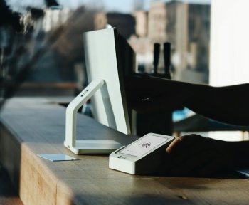 A person sitting at a desk using a computer