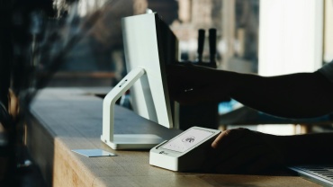 A person sitting at a desk using a computer