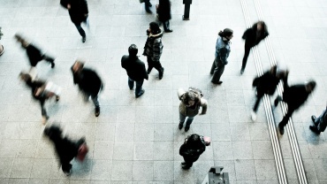 people walking on grey concrete floor during daytime