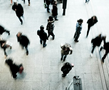 people walking on grey concrete floor during daytime