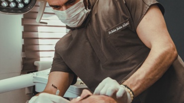 a dentist examining a patient