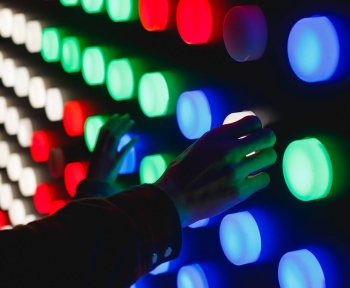 people holding assorted-color LED lights