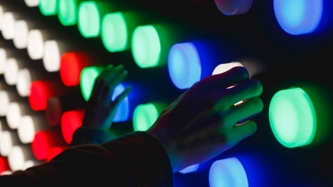 people holding assorted-color LED lights