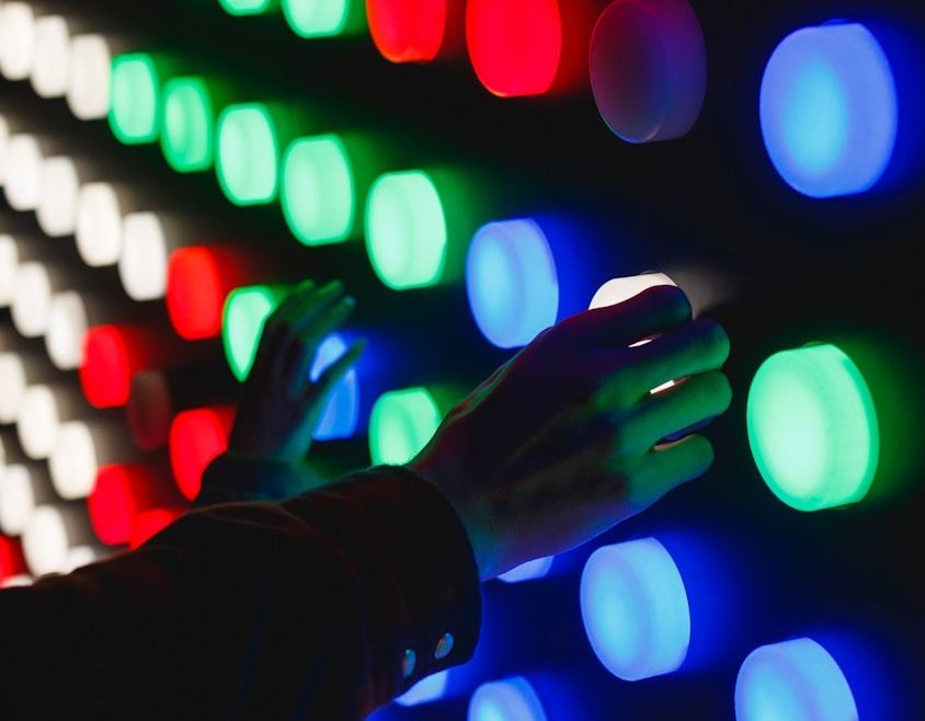 people holding assorted-color LED lights