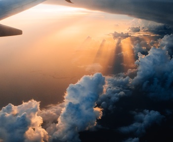 airplane on sky during golden hour