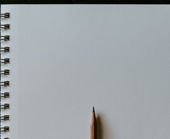 brown pencil on white surface