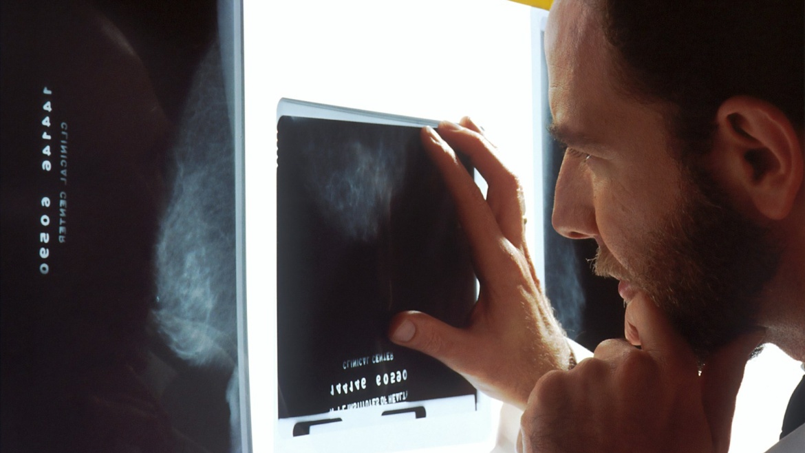 person holding black tablet computer